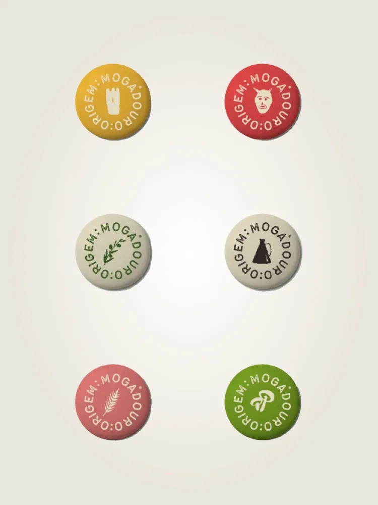 leva contigo,a essência de Mogadouro,pin da linha de merchandising